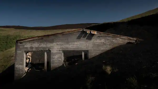 the ruins of a house formerly buried in the lava has been excavated